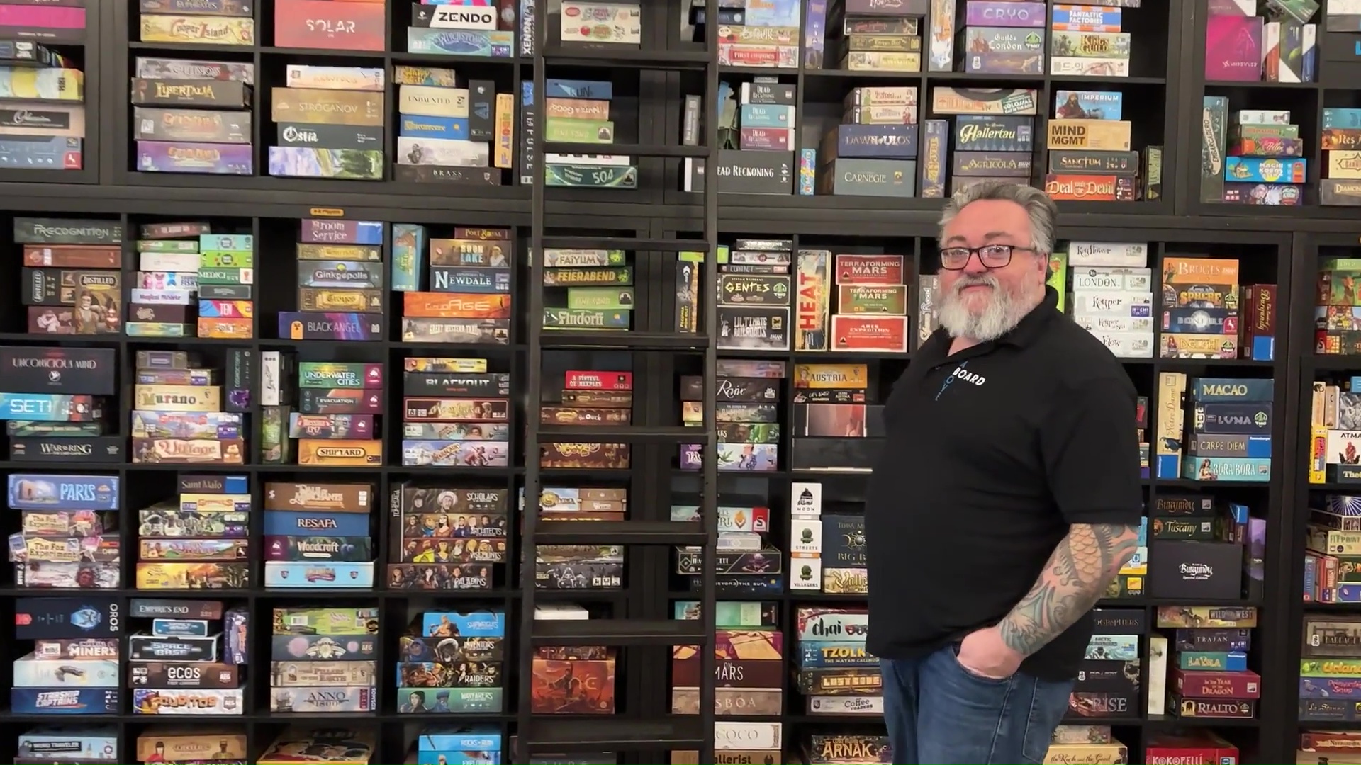 Corey Thompson with his board game collection